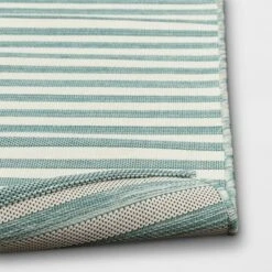 5'x7' Narrow Wornstripe Rectangular Woven Outdoor Area Rug Turquoise Blue - Threshold™ -Threshold Furnish Shop GUEST de24221f eb98 4b3d 8215 da45667ce98e